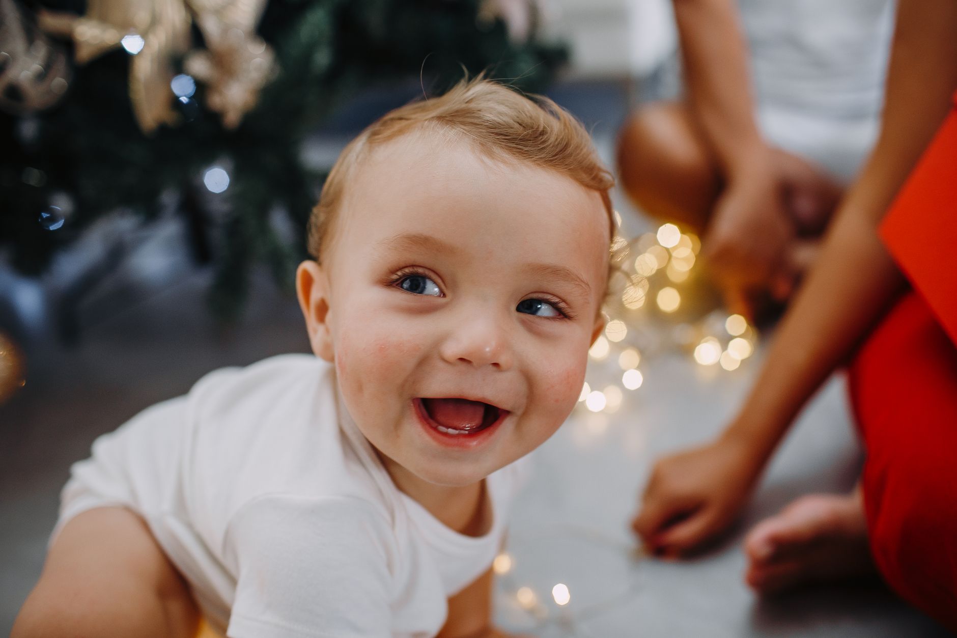 Baby, Baby Face, What Will My Baby Look Like, Future Baby, Baby Predictor, Ba — A happy baby enjoying Christmas lights and holiday atmosp