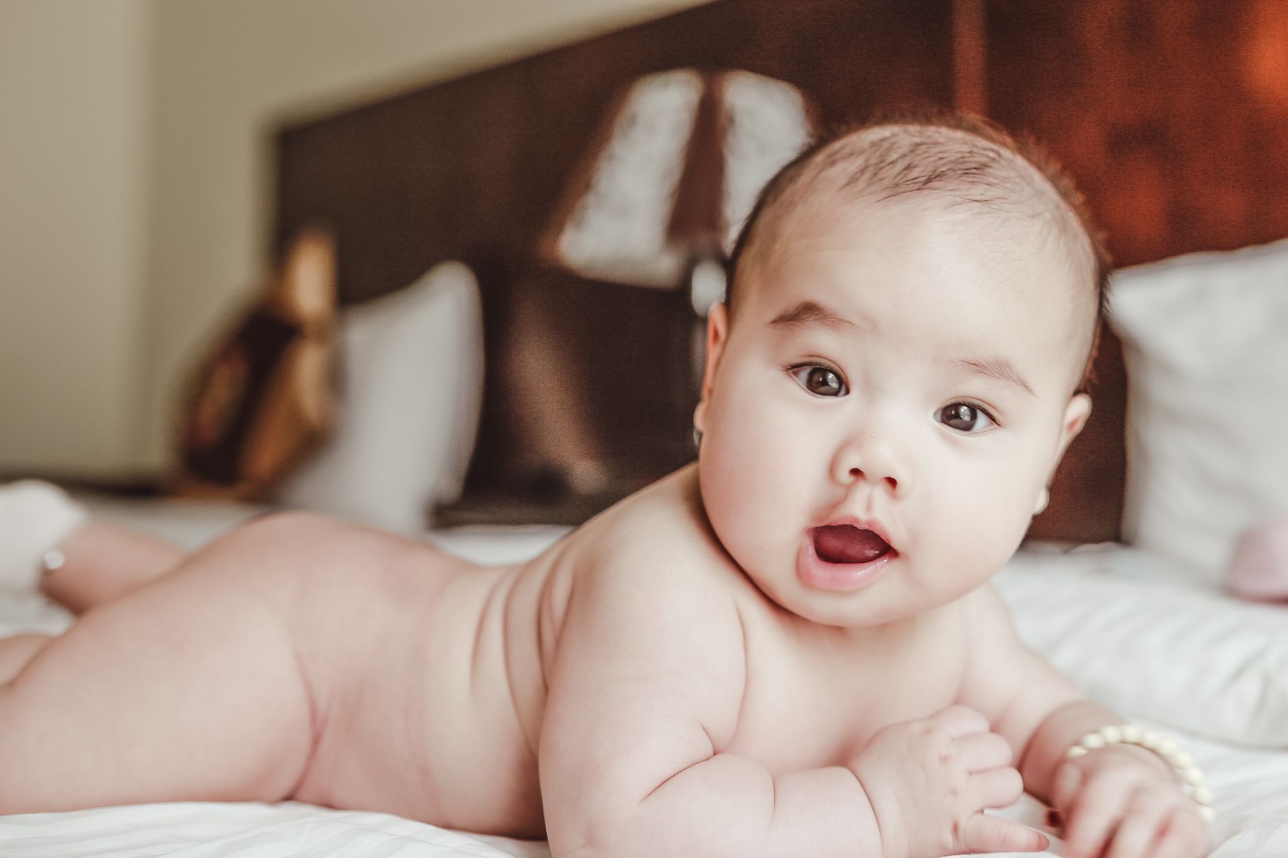 Baby, Baby Face, What Will My Baby Look Like, Future Baby, Baby Predictor, Ba — Adorable baby lying on a bed, focusing curiously. Perfect