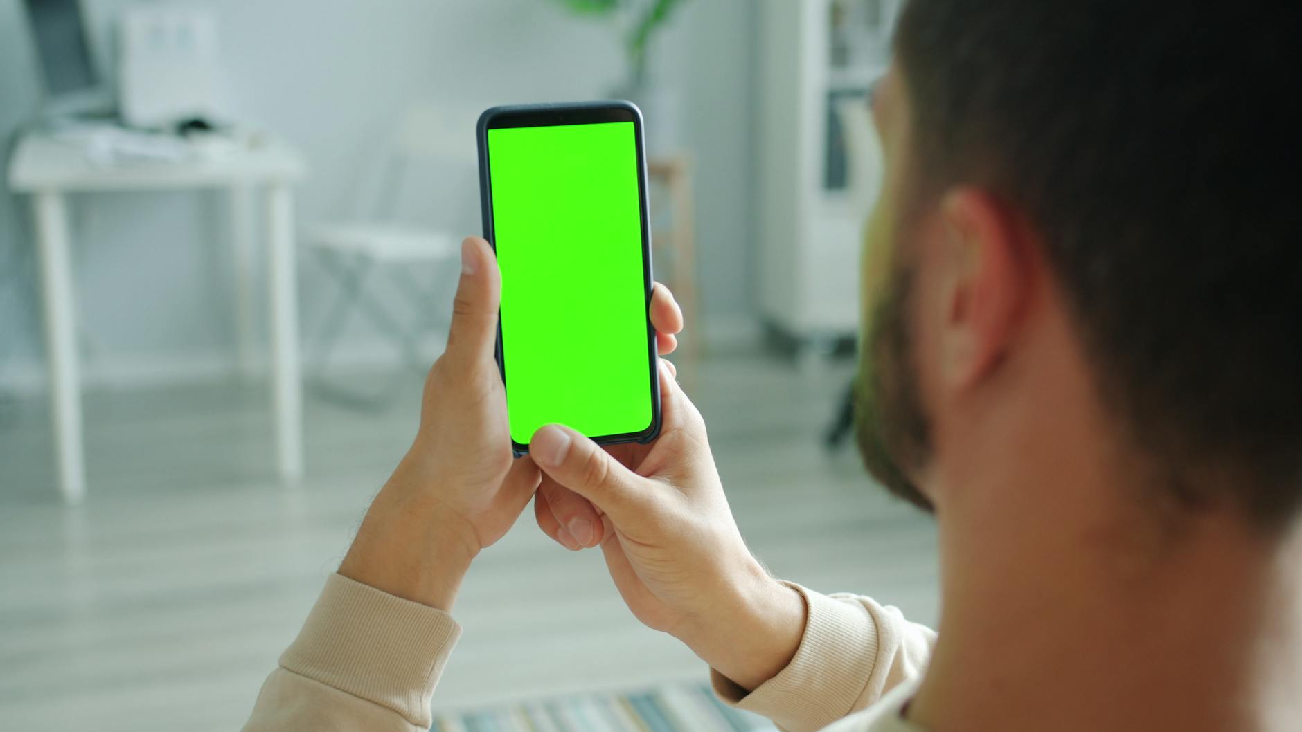 Background Remover, Remove Background From Image, Transparent Background, Backg — Man holding smartphone with green screen for mockup appli