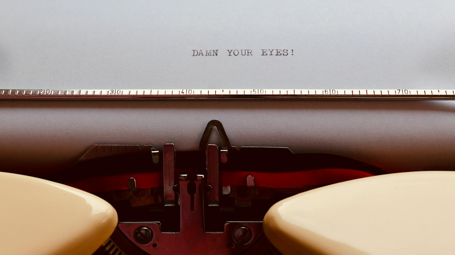 Cover Letter, Cover Letter Writer, Job Application Letter, Cover Letter — Close-up of a vintage typewriter with paper displaying Damn you