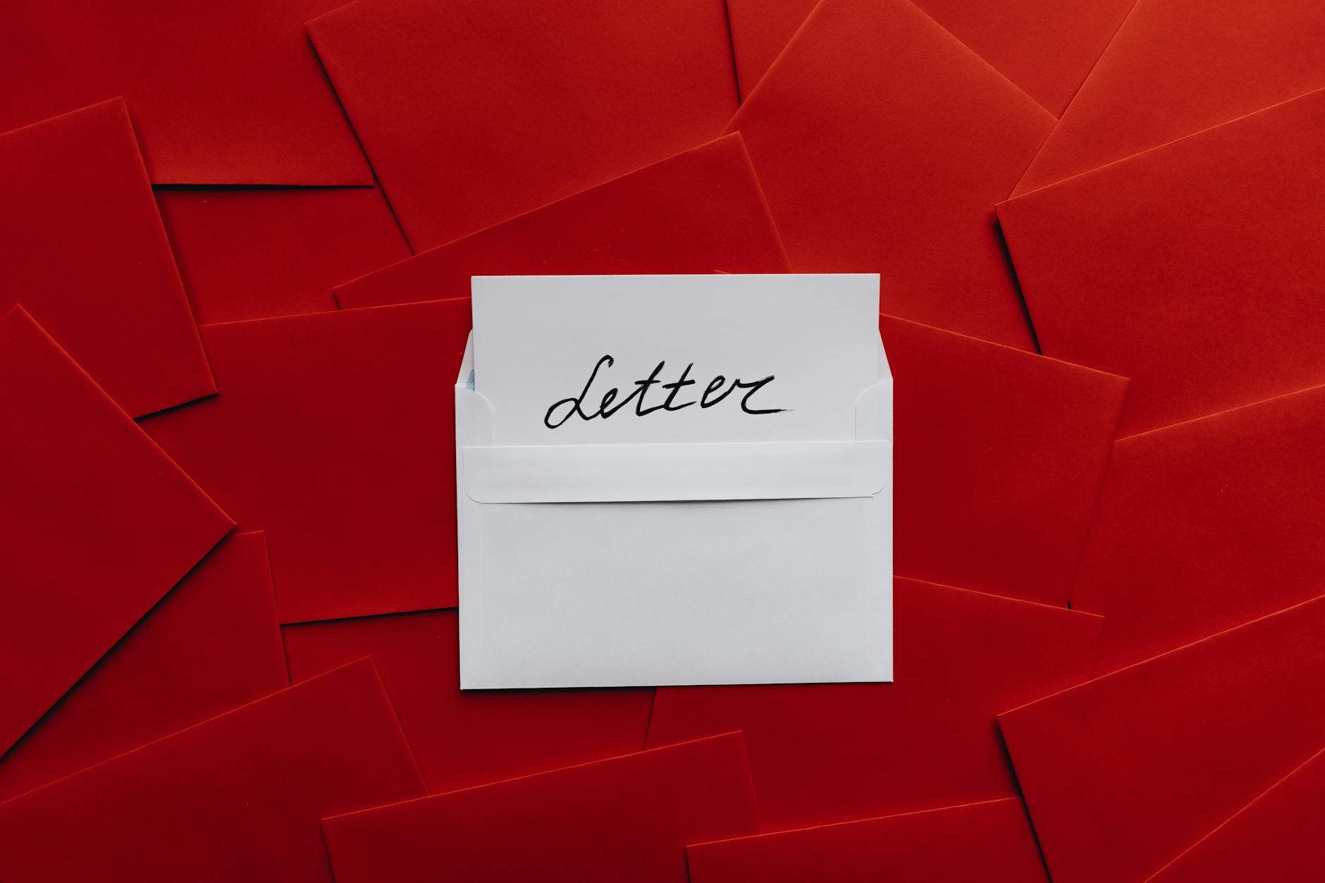 Cover Letter, Cover Letter Writer, Job Application Letter, Cover Letter — White envelope with letter inside surrounded by red envelopes, 