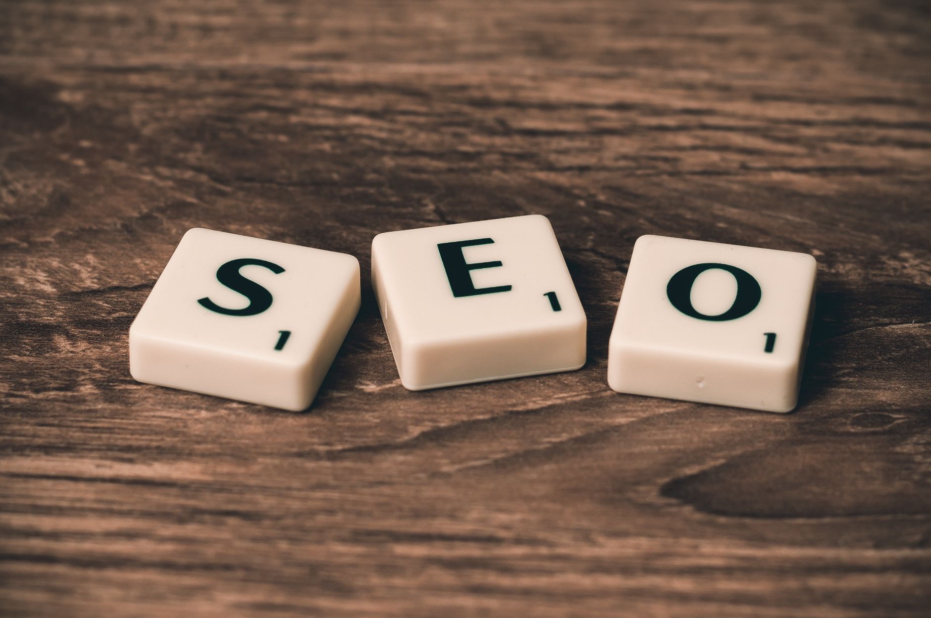 Digital Marketing Tools, SEO Optimization, PPC Campaign Management, Social Media — Scrabble tiles spelling SEO on a wooden surface. Ideal fo