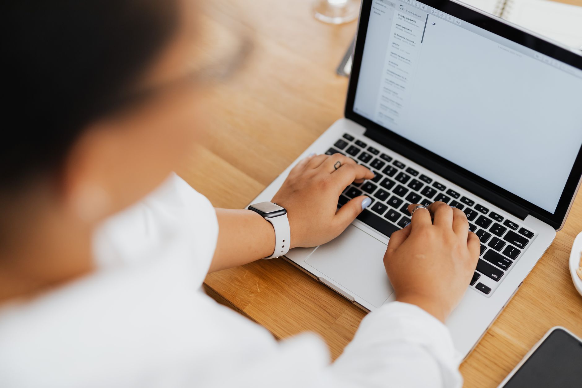For Email, Email Writer, Email, For Email Management, For Email Writing — High angle shot of a person typing on a laptop, focused on hands 