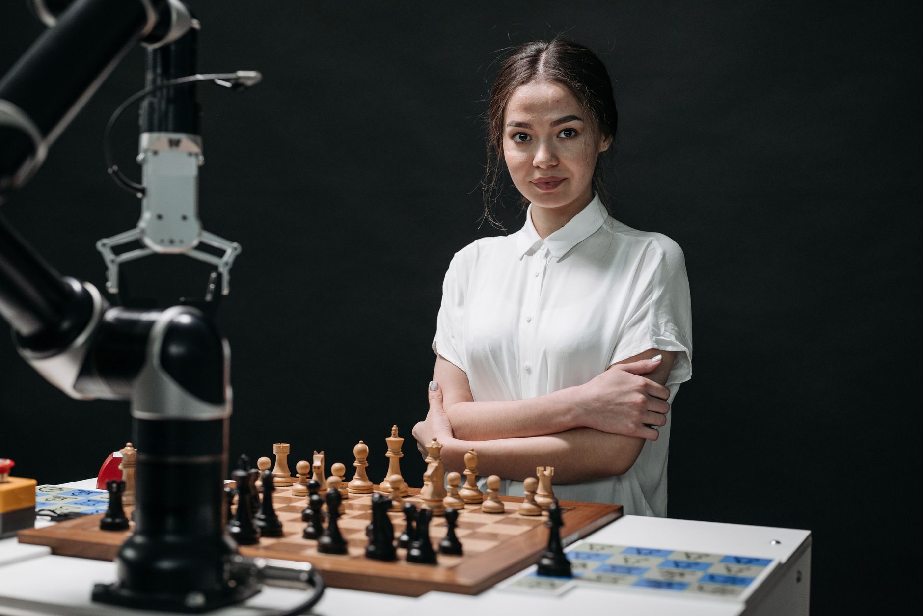 For Games, For Gaming, For Video Games, Artificial Intelligence For Games, For G — A young woman in a white blouse playing chess against a r