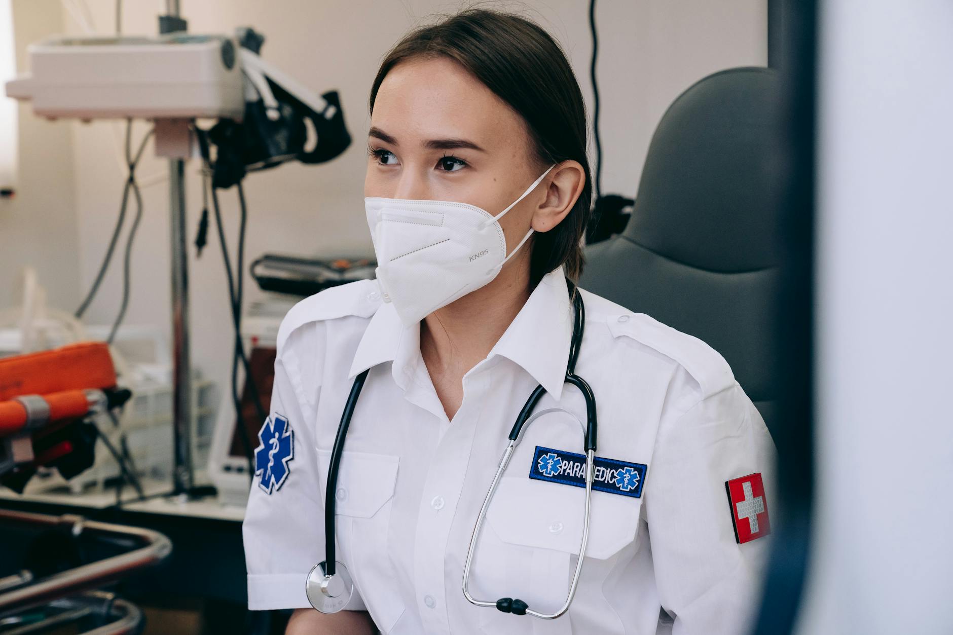 For Healthcare, Clinical Decision Support, Medical Assistant, Health Education, — A female paramedic wearing a face mask with a stethoscope