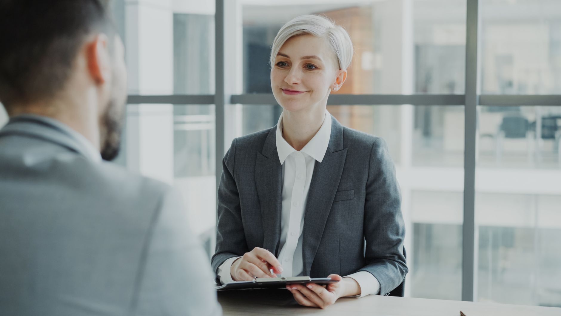 For Hr, For Human Resources, For Recruiting, For Hiring — Confident woman interviewing candidate in a modern office. Ideal for business and 