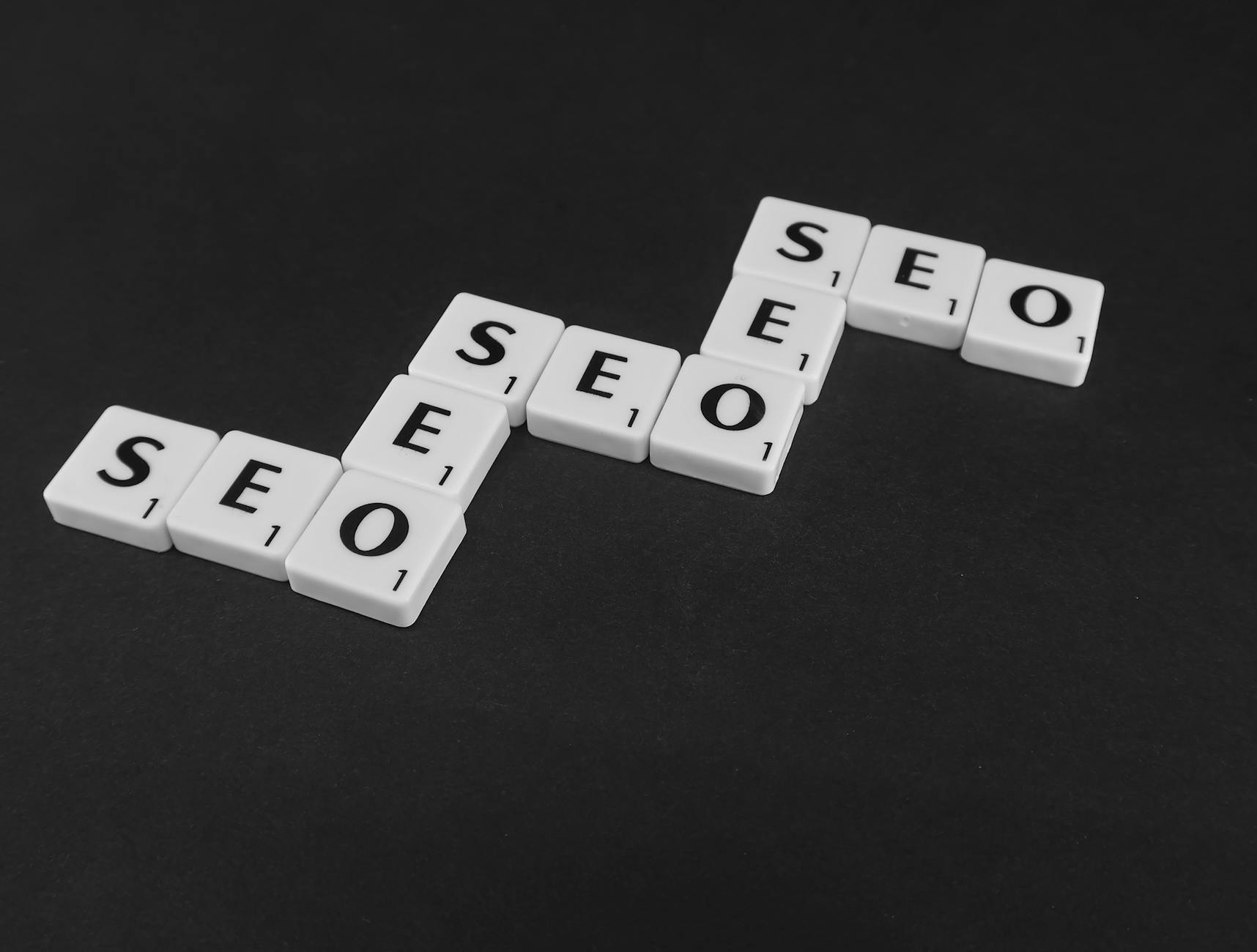 For Seo, Seo Writer, Seo Content, For Seo Writing, Seo — SEO spelled with Scrabble tiles on a black surface, representing search engine opt