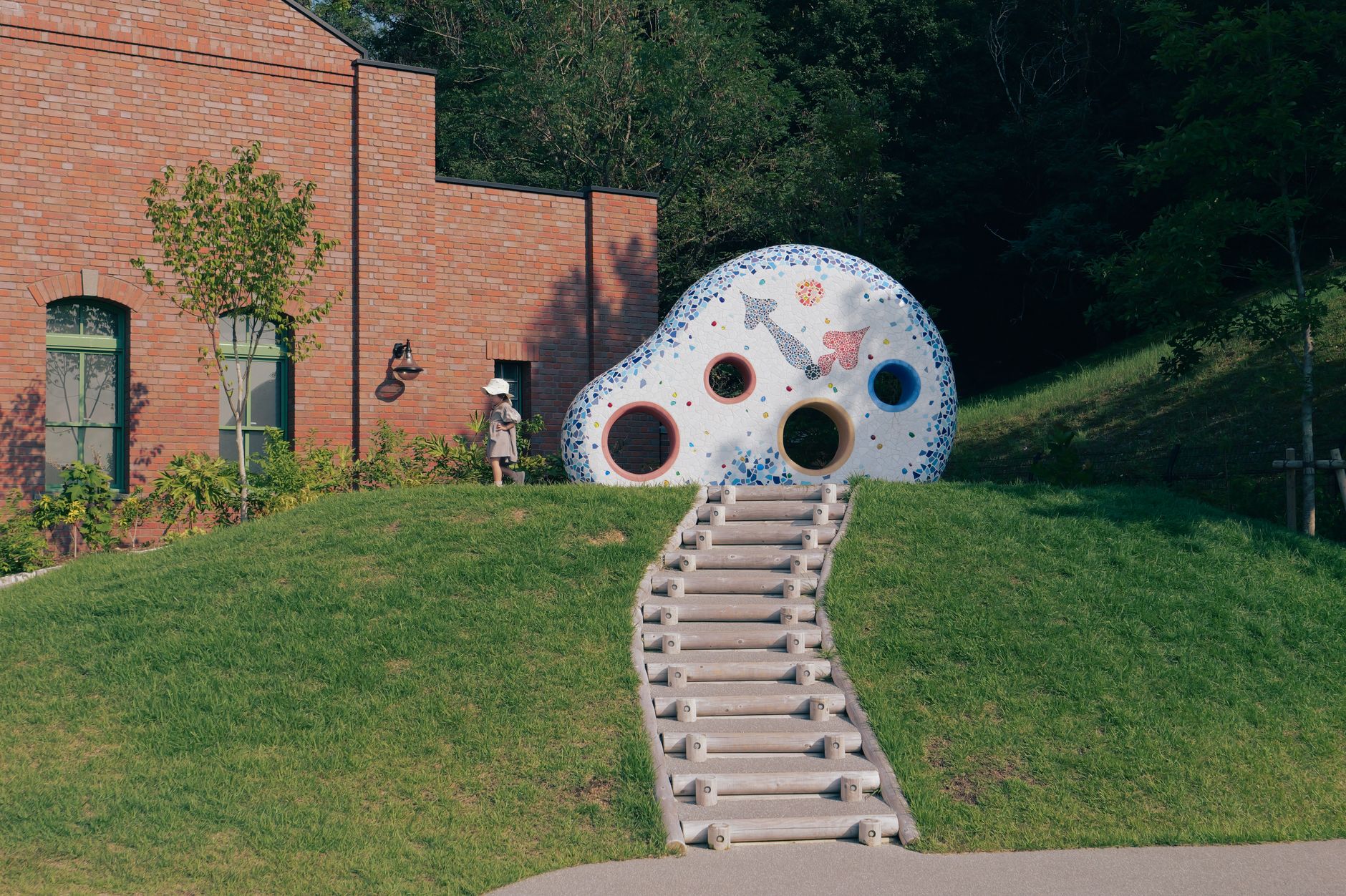 Ghibli Art,Ghibli Style Art,Studio Ghibli,Ghibli Art, Anime Art Ghibli,Ghibli — A park in Nagoya, Japan with playful sculpture and grassy