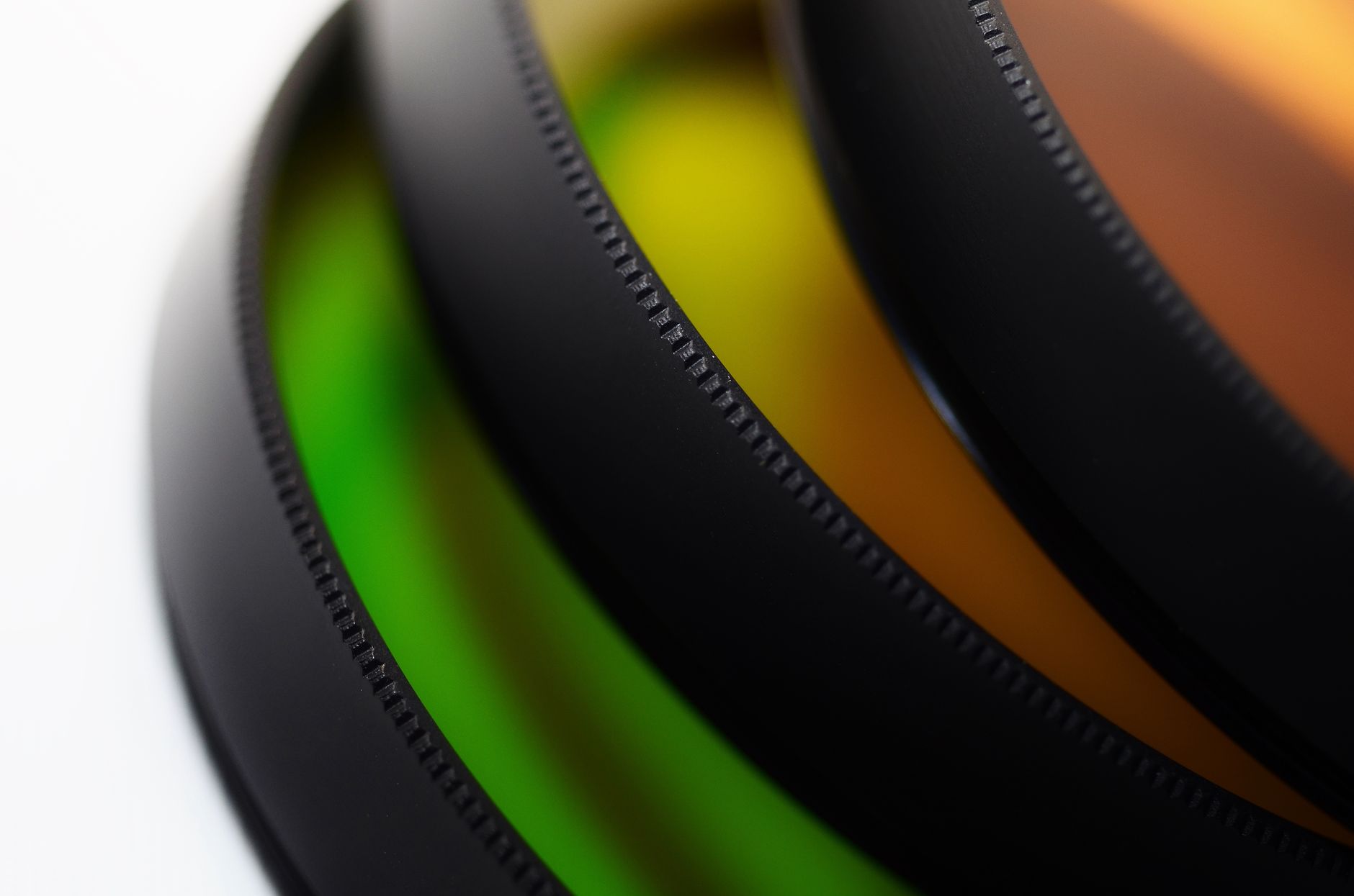 Image Upscaler, Upscale Image, Enhance Image Quality, Image Enhancer, Increase — Close-up view of multi-colored camera lens filters showca