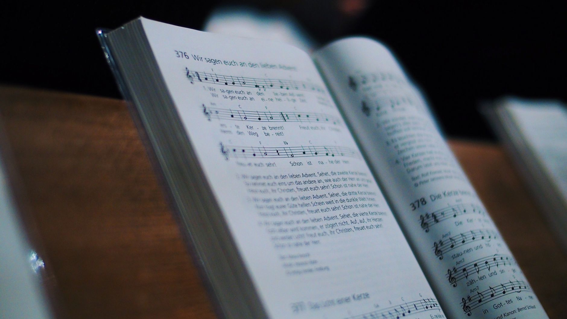 Music, Music, Jingle, Text To Music, Background Music — An open music book displaying sheet music and notations. Ideal for music and edu