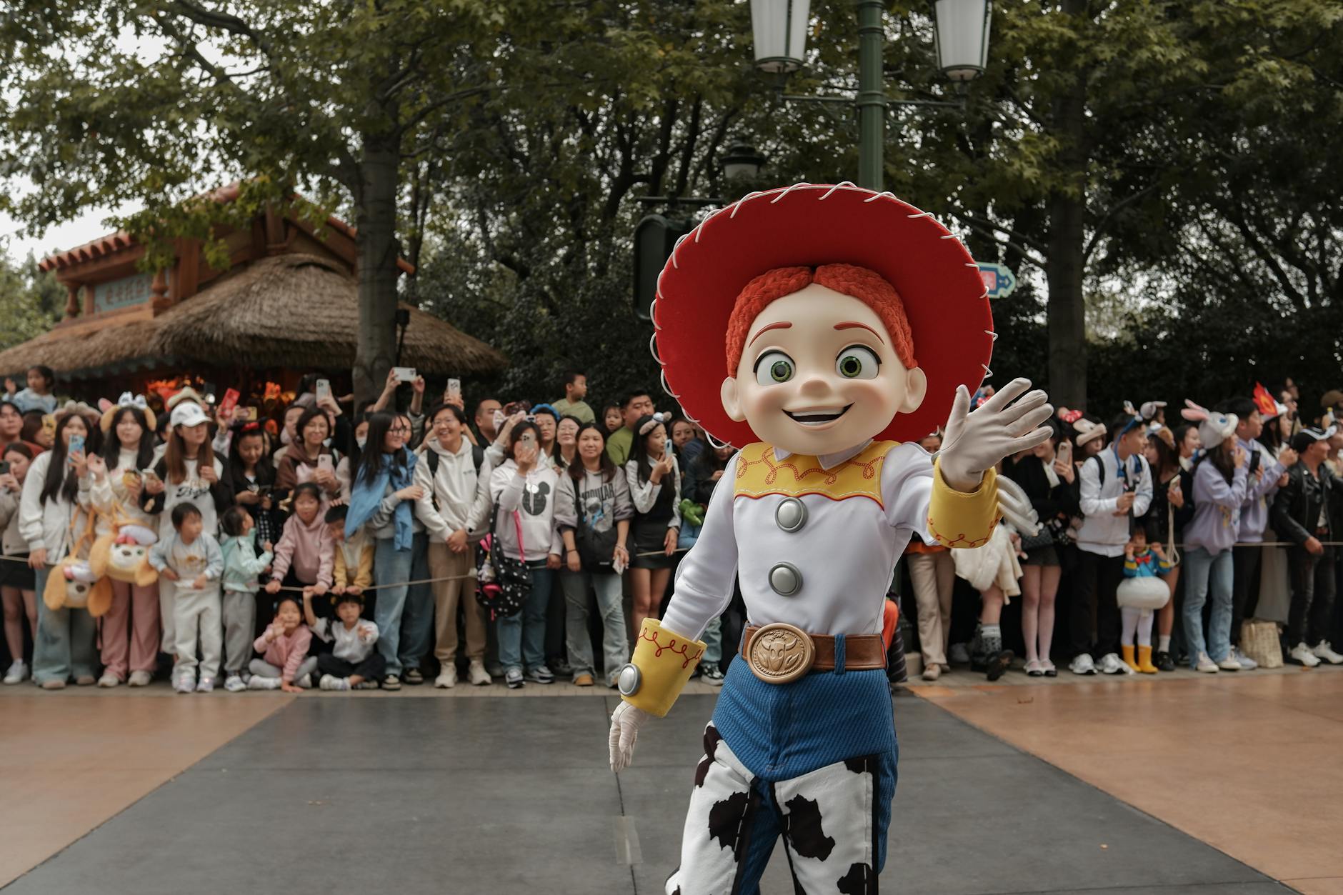 Pixar Character — A vibrant Toy Story character parade at Shanghai Disneyland, featuring enthusiastic crowds and lively atmosphere.