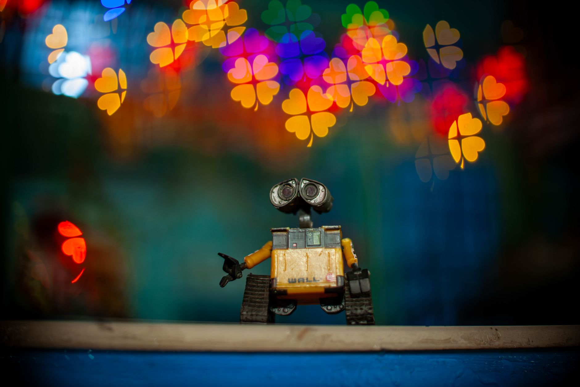 Pixar Character, Pixar Character, Pixar Style Character, 3d Character, Pixar — Toy Wall-E figure against vibrant heart-shaped bokeh ligh