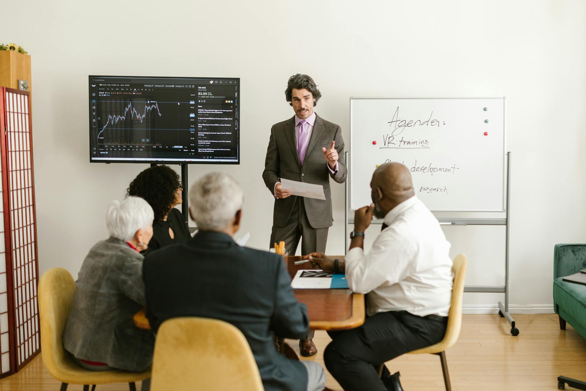 PowerPoint Presentation, Best For PowerPoint Slides, Presentation, -Powered Sl — A corporate professional presents market data during a te