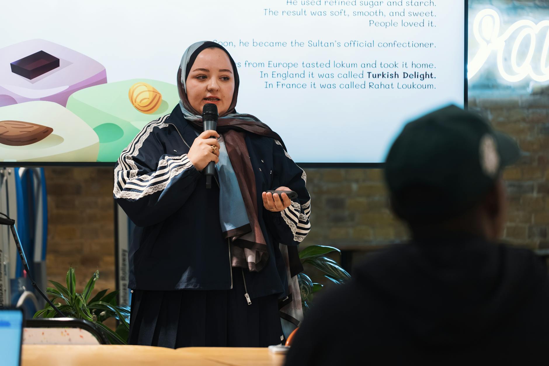 Presentation, Presentation, Create Presentations With, Slideshow, Powered Pr — Woman presenting about Turkish Delight with an informativ