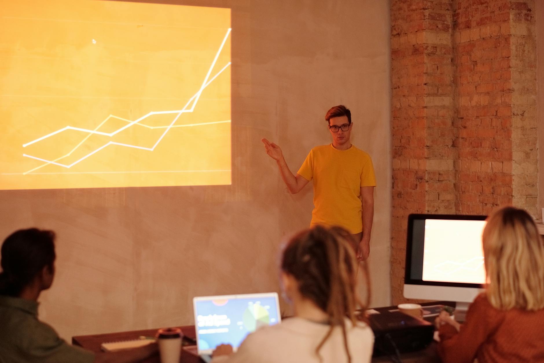 Presentation, Presentation, Create Presentations With, Slideshow, Powered Pr — A young man gives a presentation on data analysis in a mo
