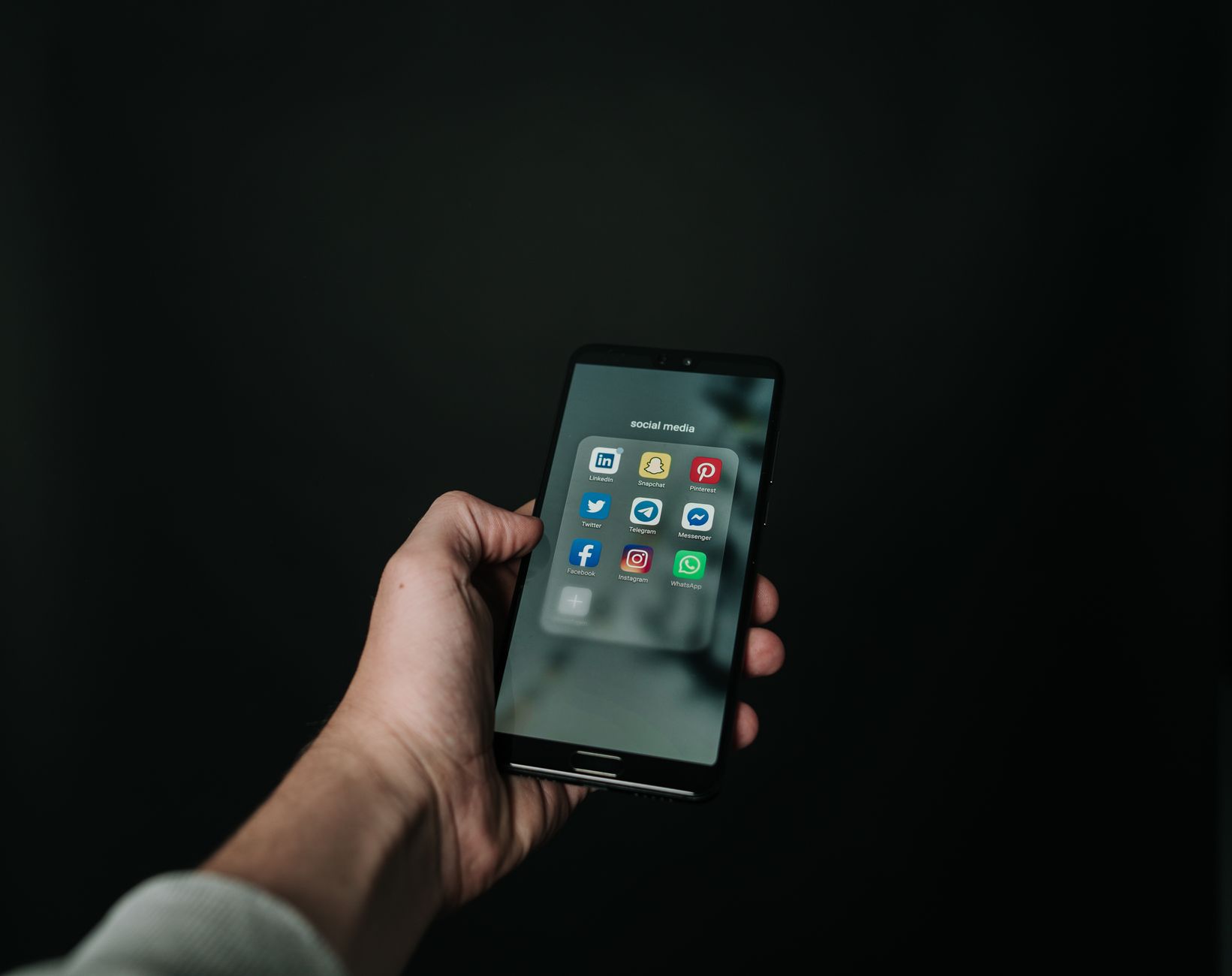 Social Media Post, For Social Media, Instagram Caption, Twitter Post, Linkedin — Close-up of a hand holding a smartphone displaying variou