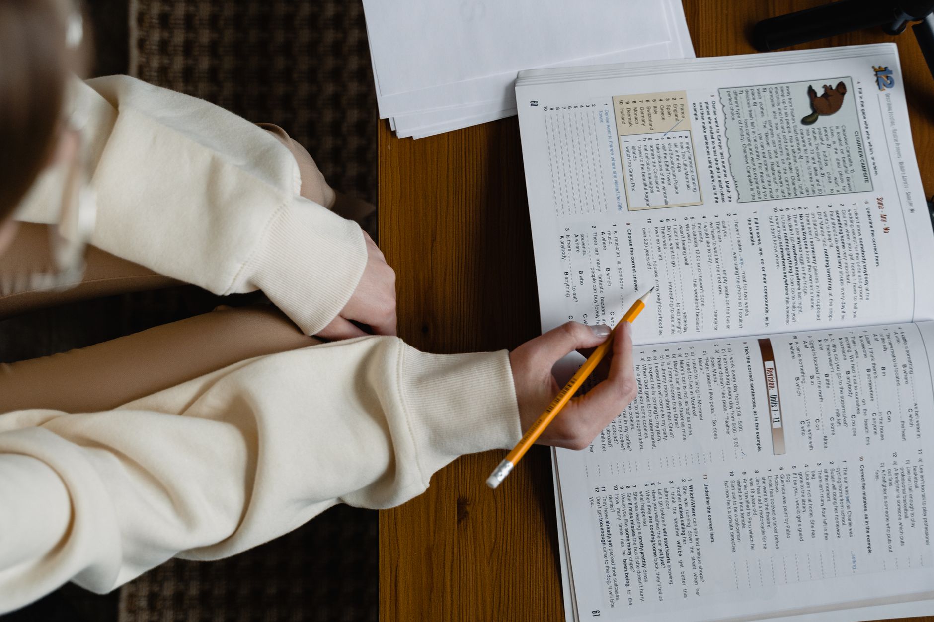 Study Helper, For Students, Study Companion, Homework Help, Study Smarter With, — A student studying from an open book, holding a pencil, i