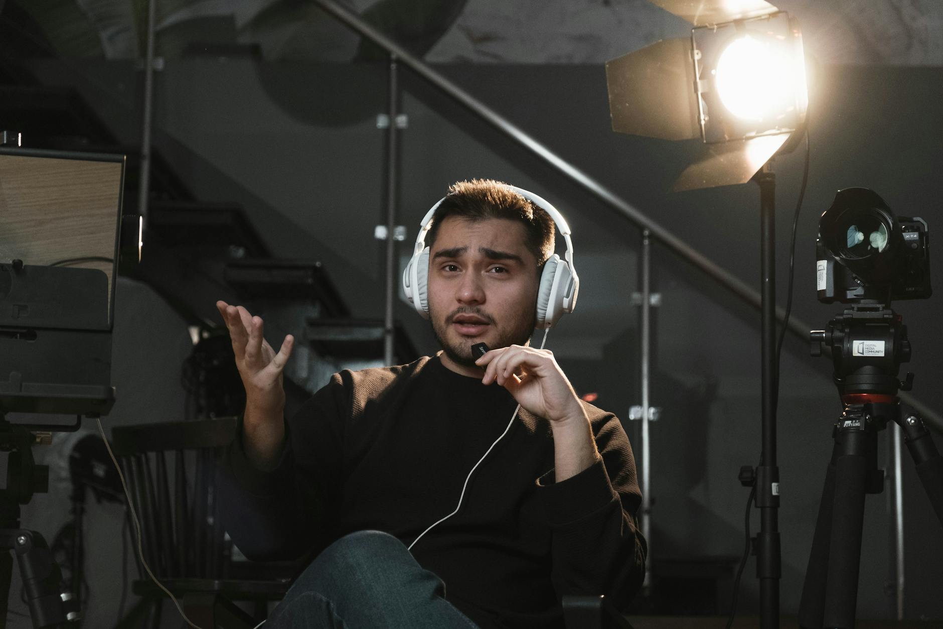 Talking Avatar, Video Avatar, Text To Video With Avatar, Presenter, Spokesperson — Portrait of a man wearing headphones, sitting in a studio