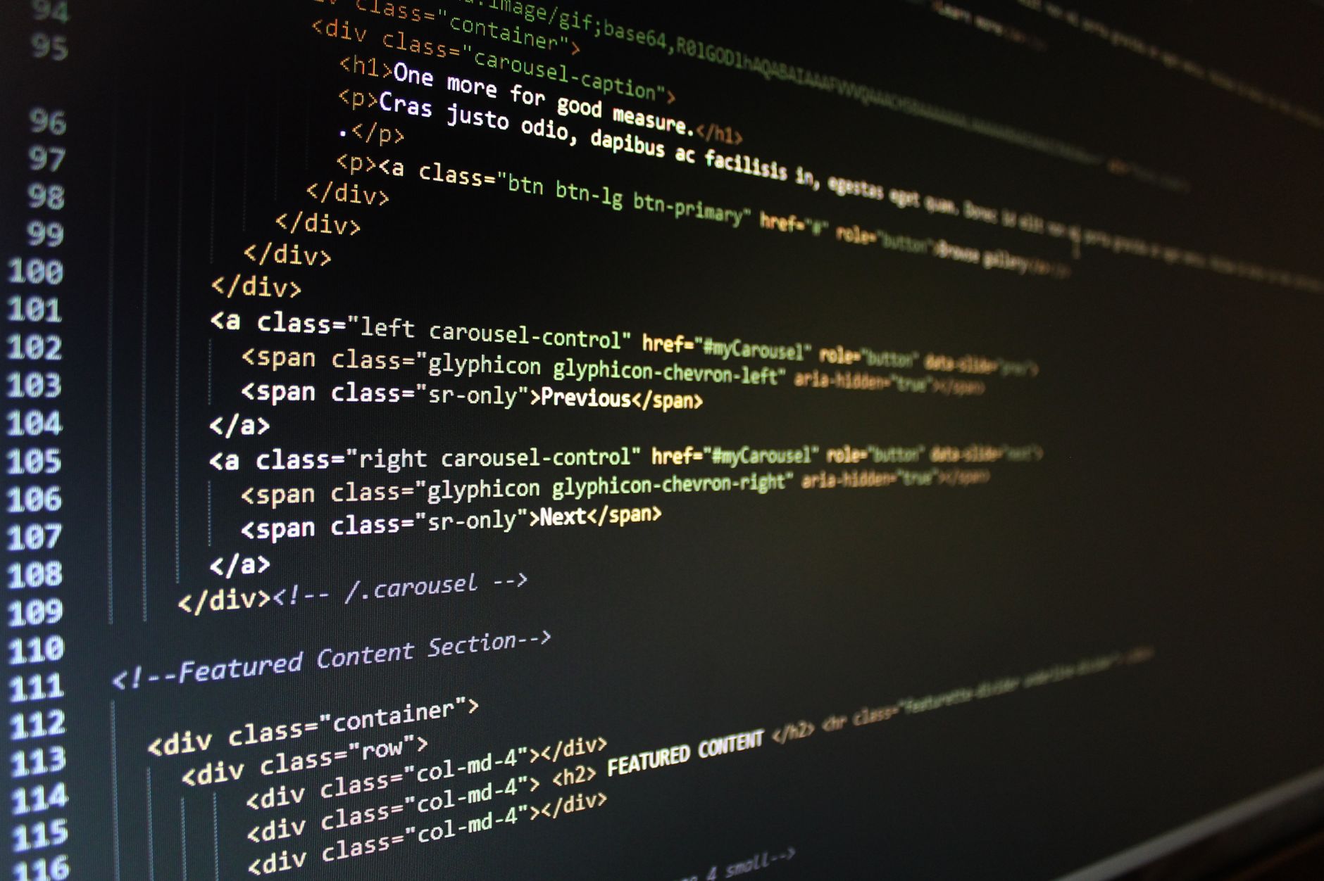 Web Development, Website Builder, Build Website With, Coding Assistant For Web — Close-up of HTML code displayed on a computer monitor, sh