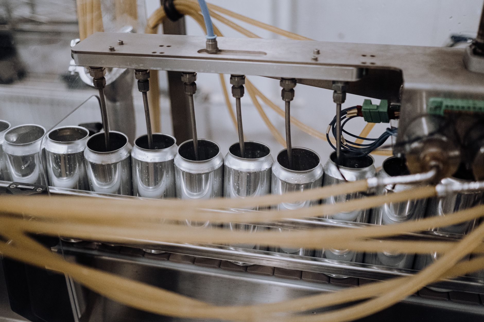 Workflow Automation, Automate Repetitive Tasks With, Process Automation Tools, — Close-up of automated machinery on a beverage can filling