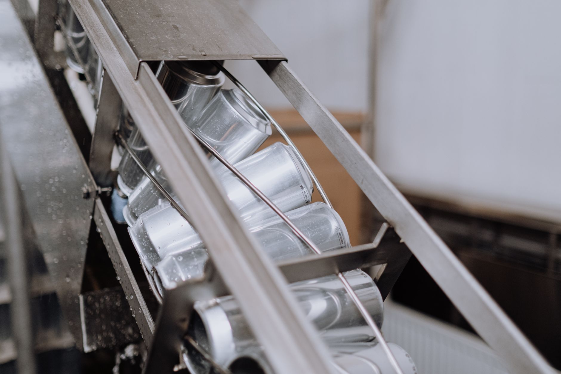Workflow Automation, Automate Repetitive Tasks With, Process Automation Tools, — Close-up of automated canning equipment in a brewery show