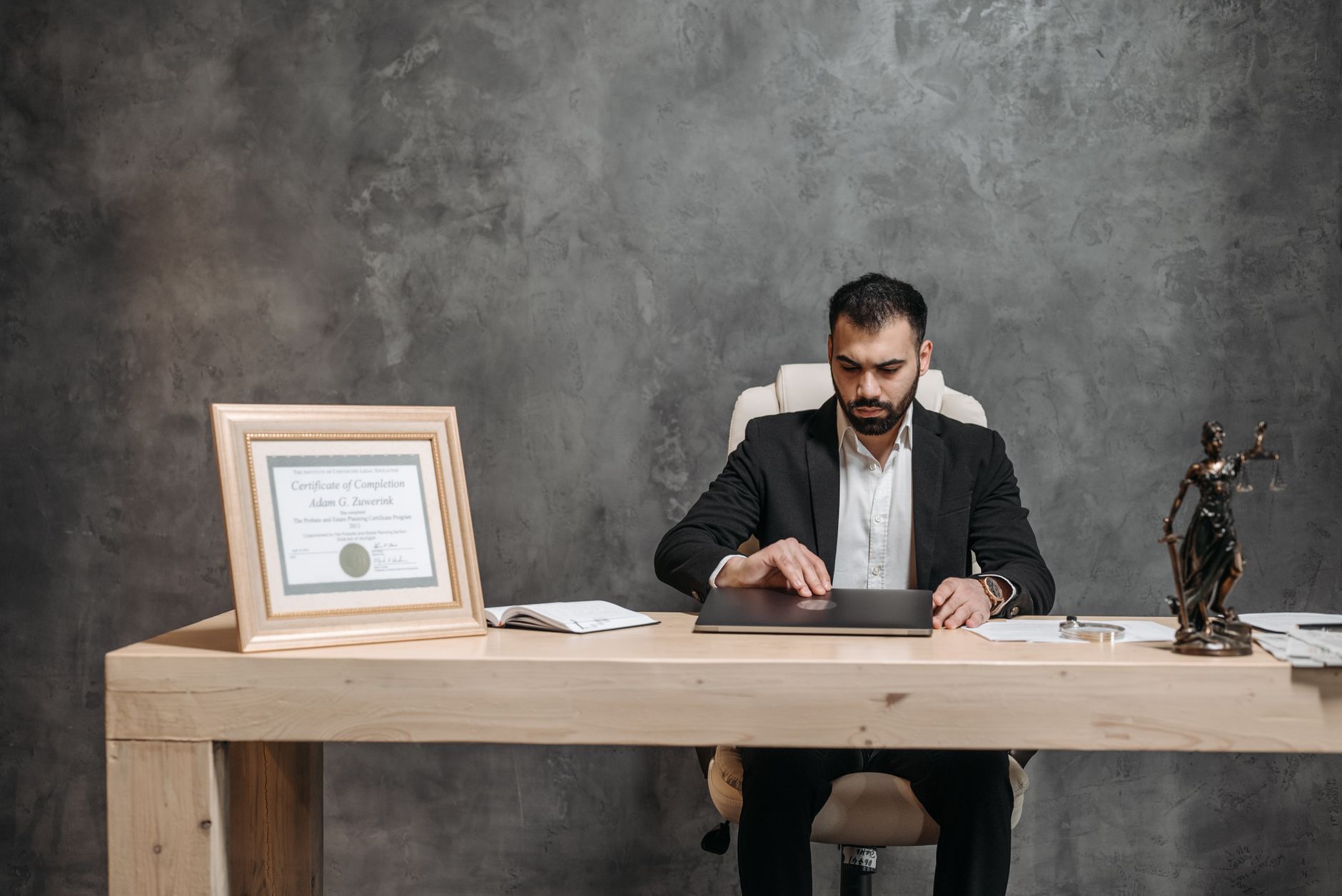 Best For Lawyers — A bearded lawyer working at his office desk, showing professionalism and expertise.